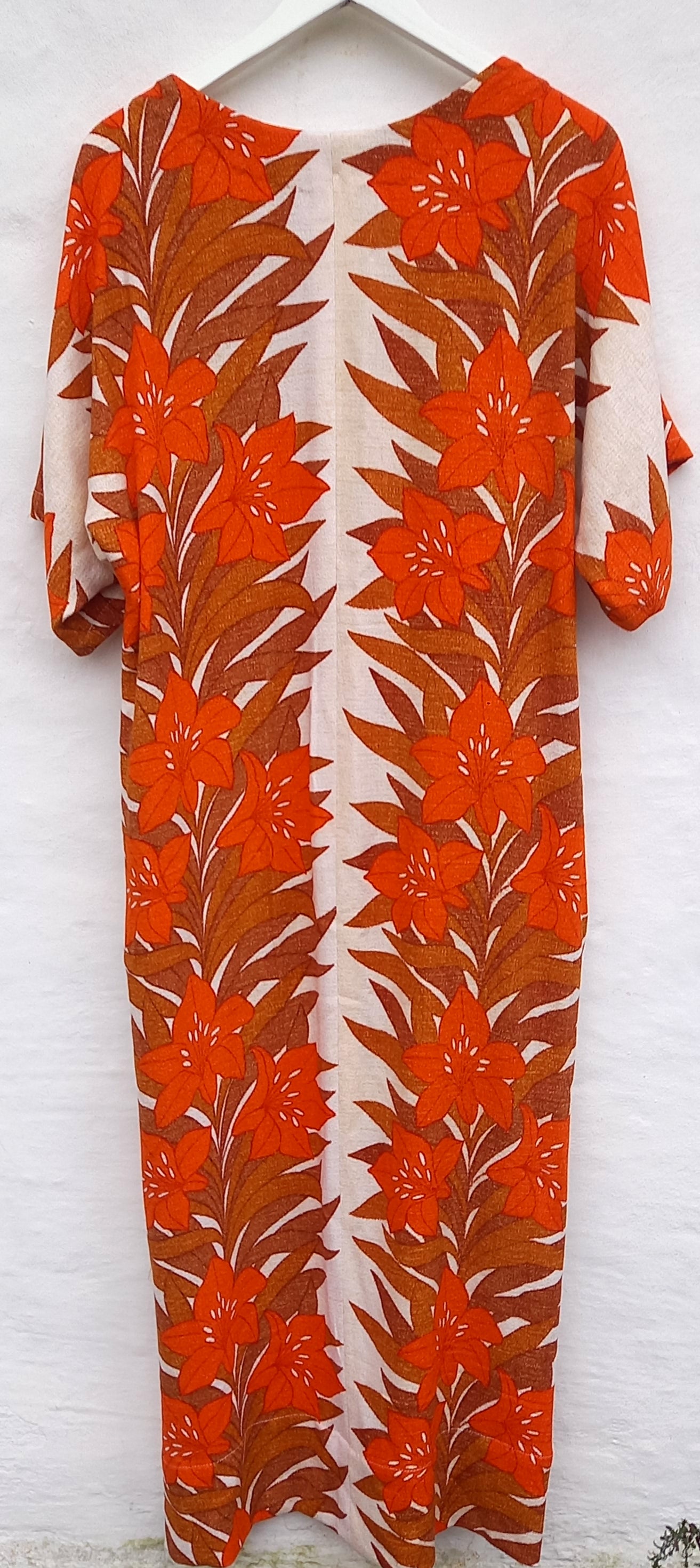 Tonga dress back view showing vintage 1970s hibiscus pattern detail
