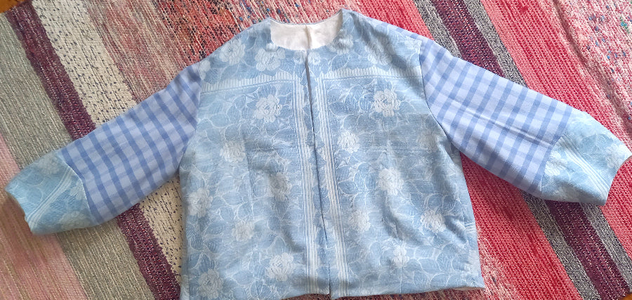 Cesaria jacket close-up of vintage tablecloth fabric and damask lining
