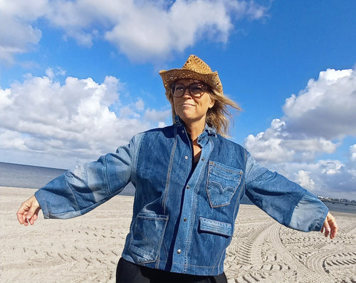 Cowgirl denim jacket from upcycled jeans with damask tablecloth lining, front view
