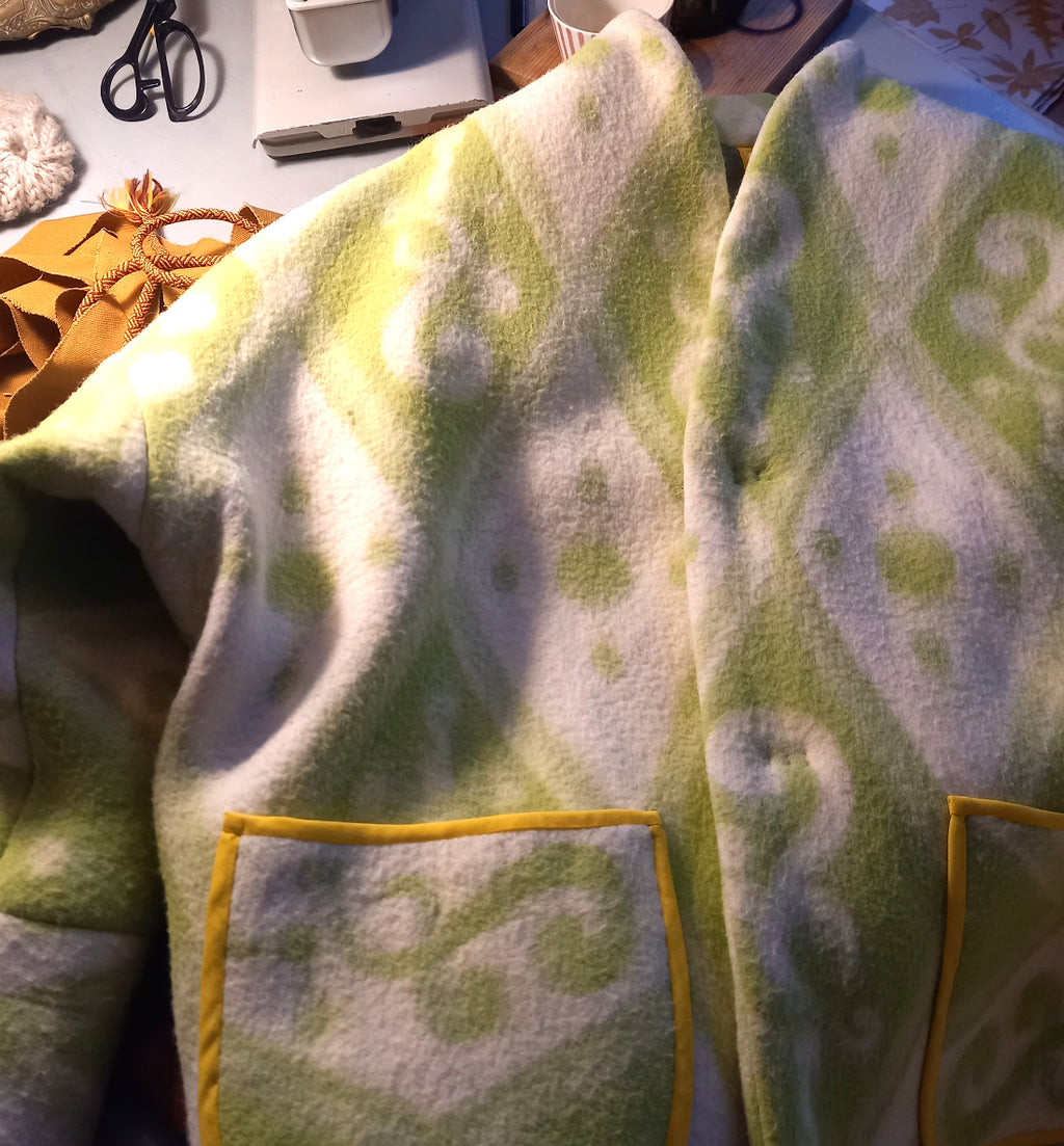 Hold'em jacket front view showing vintage wool and polyester textile detail, yellow pocket boarders
