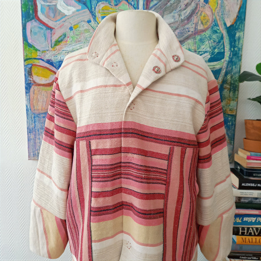 Malmösita jacket detail showing damask lining and handmade stitching
