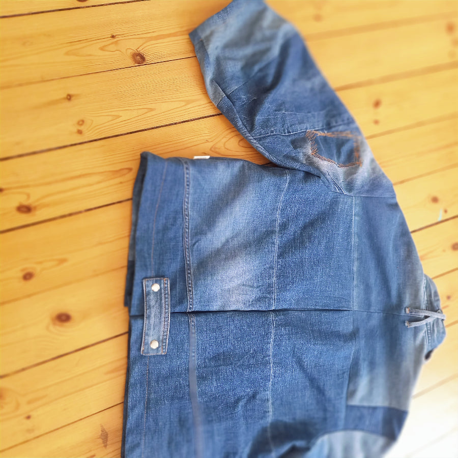 Cowgirl denim jacket side view displaying handmade details
