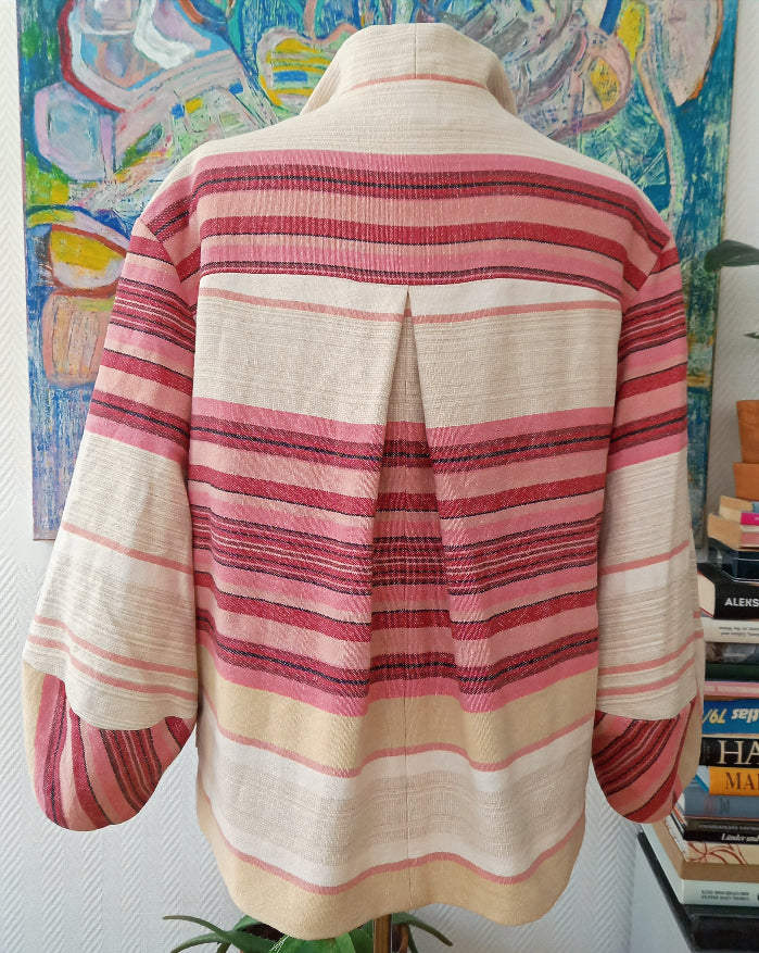 Malmösita jacket back view showing vintage cotton tablecloth textile detail
