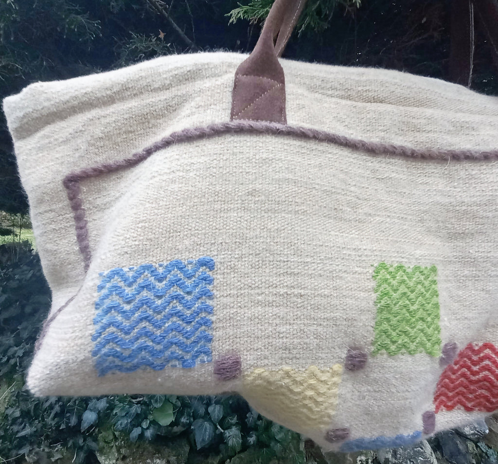 Wooly vintage wool bag detail showing handmade construction and leather handles
