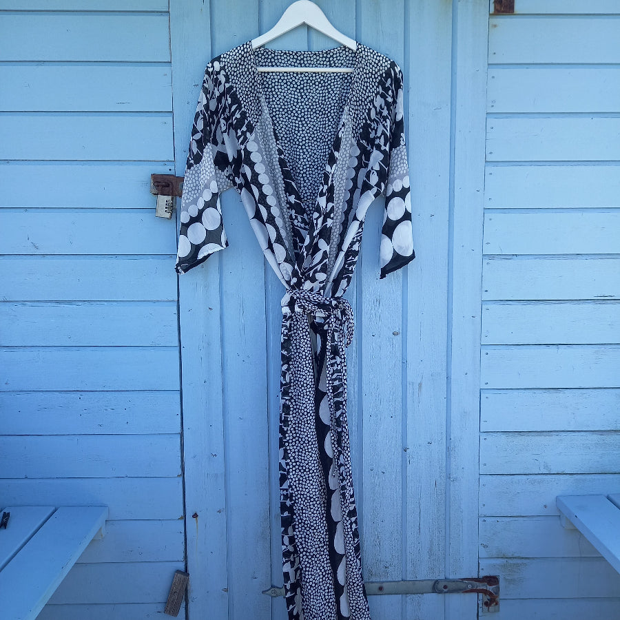 Ragazza wraparound dress front view displaying elegant drape and construction
