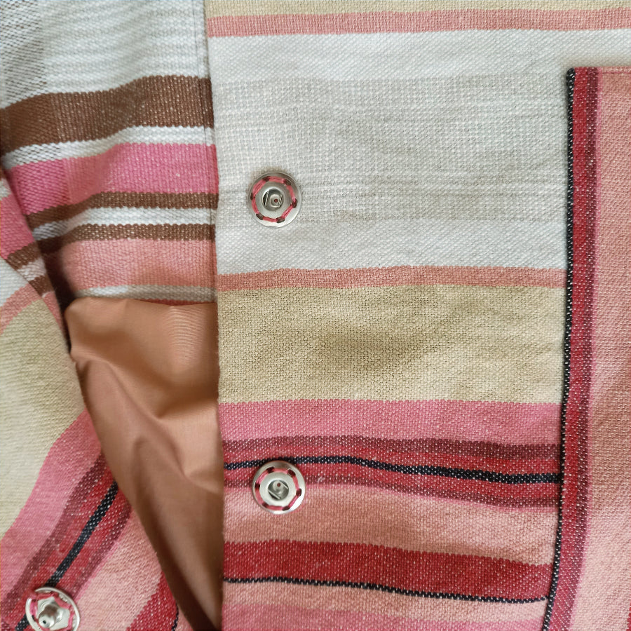 Malmösita jacket close-up of vintage tablecloth fabric pattern
