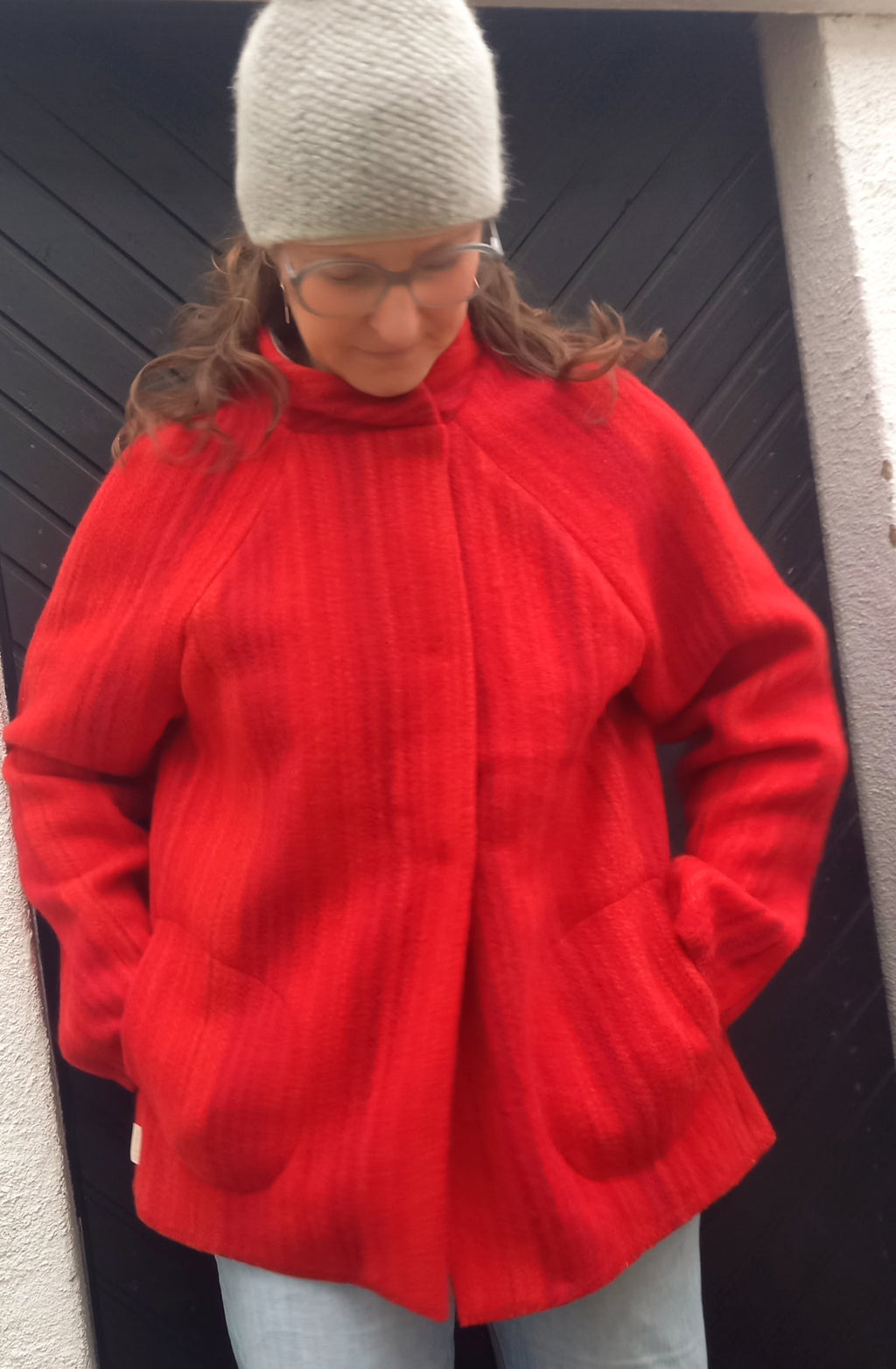 Red Viola Gråsten jacket front view showing iconic Swedish designer textile

