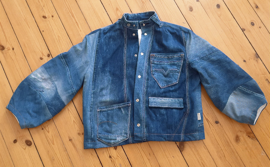 Cowgirl jacket close-up of denim fabric and damask lining detail
